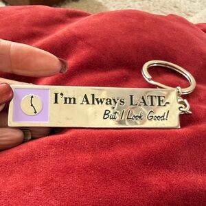 Humorous Silver Keychain with Clock Design